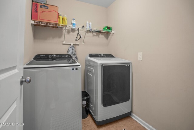 42 Kiawah Dr, Beaufort, SC 29906 - laundry room with washer and clothes dryer, baseboards, and light tile patterned flooring
