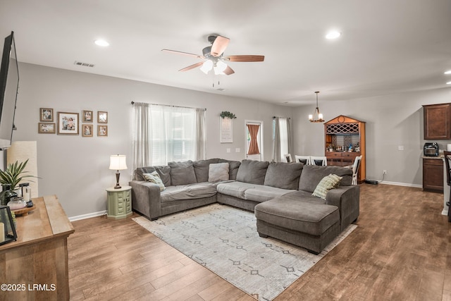 42 Kiawah Dr, Beaufort, SC 29906 - living room featuring a ceiling fan, wood finished floors, recessed lighting, a chandelier, and baseboards