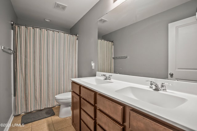 42 Kiawah Dr, Beaufort, SC 29906 - full bath with toilet, tile patterned floors, double vanity, and a shower with shower curtain