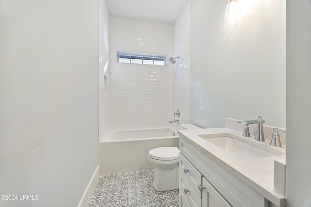 bathroom featuring baseboards, toilet, tile patterned flooring, vanity, and shower / washtub combination