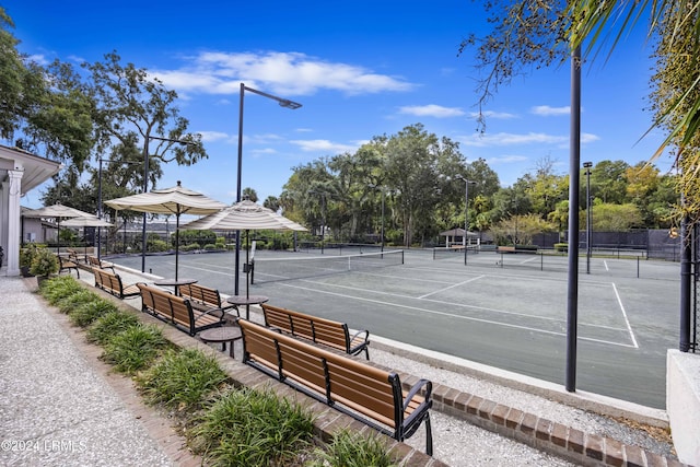 view of sport court with fence