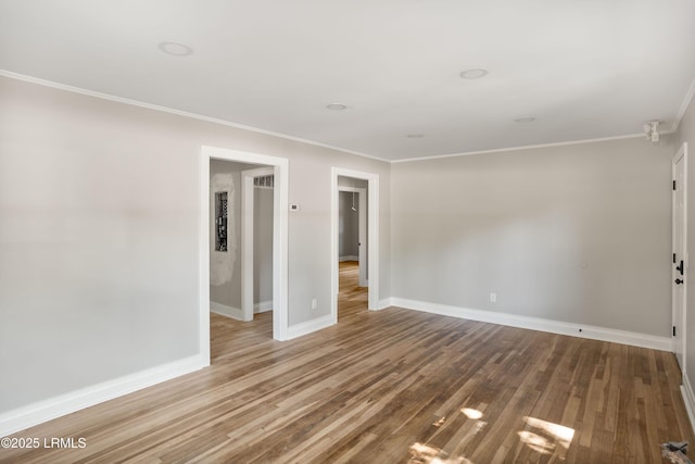 67 Sams Point Rd, Beaufort, SC 29907 - spare room featuring baseboards, wood finished floors, and crown molding