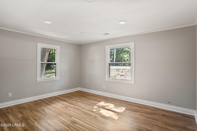 67 Sams Point Rd, Beaufort, SC 29907 - empty room with recessed lighting, wood finished floors, visible vents, crown molding, and baseboards