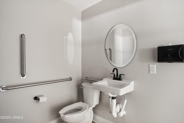 67 Sams Point Rd, Beaufort, SC 29907 - half bathroom with toilet, baseboards, and a sink