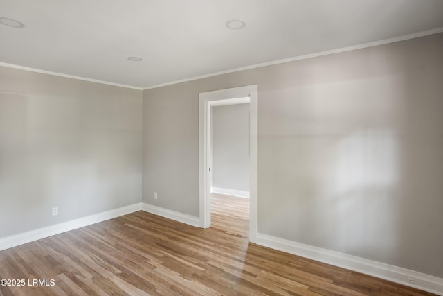 67 Sams Point Rd, Beaufort, SC 29907 - unfurnished room with light wood-type flooring, baseboards, and ornamental molding