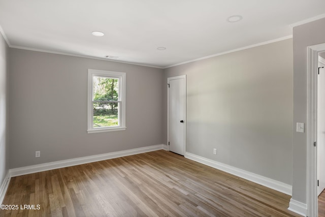 67 Sams Point Rd, Beaufort, SC 29907 - empty room featuring baseboards, ornamental molding, wood finished floors, and visible vents