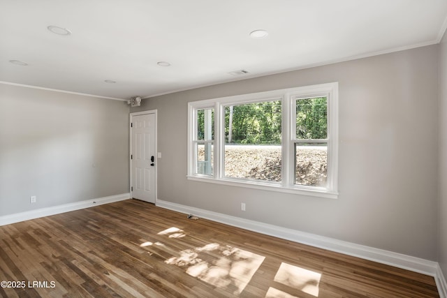 67 Sams Point Rd, Beaufort, SC 29907 - empty room featuring baseboards, ornamental molding, wood finished floors, and visible vents