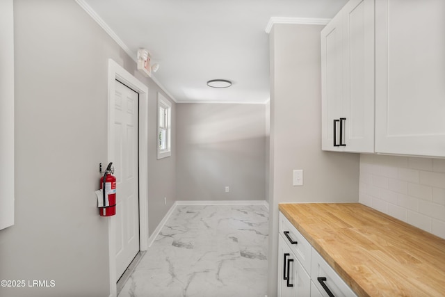 67 Sams Point Rd, Beaufort, SC 29907 - interior space featuring crown molding, marble finish floor, and baseboards