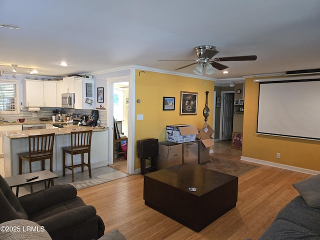 522 Meritta Ave, Beaufort, SC 29902 - living area with crown molding, a ceiling fan, light wood-style flooring, and recessed lighting