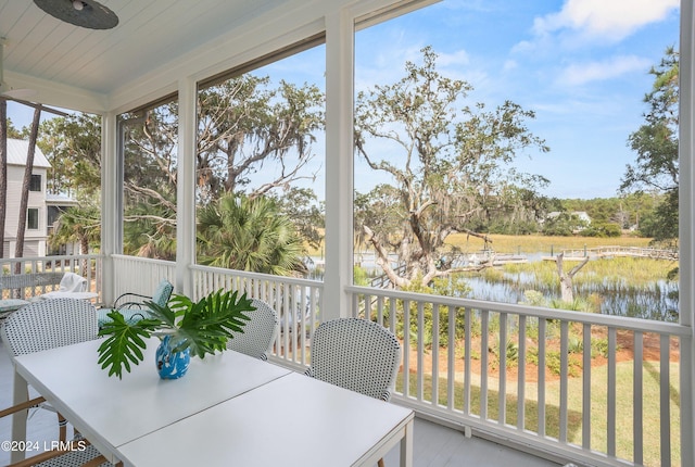 sunroom with a water view