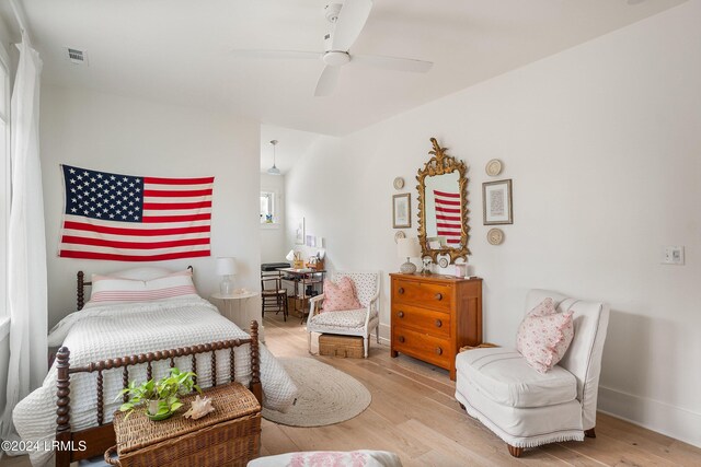 bedroom with ceiling fan and light hardwood / wood-style floors