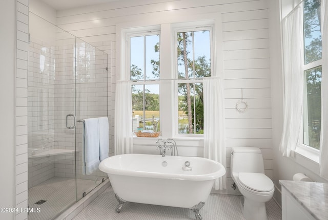 bathroom with tile patterned flooring, wooden walls, and plus walk in shower