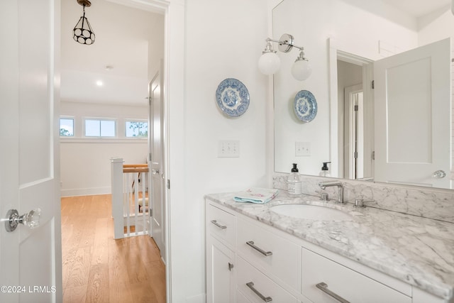 bathroom featuring hardwood / wood-style flooring and vanity