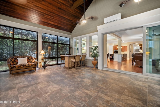 33 Little Pine Ct, Bluffton, SC 29910 - sunroom / solarium featuring high vaulted ceiling, stone finish flooring, a wall unit AC, and wooden ceiling