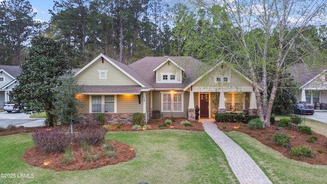 33 Little Pine Ct, Bluffton, SC 29910 - craftsman-style home featuring stone siding, a front yard, and covered porch