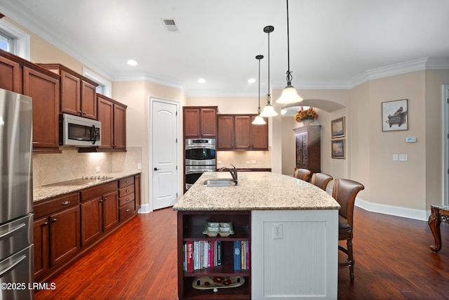 33 Little Pine Ct, Bluffton, SC 29910 - kitchen with stainless steel appliances, visible vents, a sink, a kitchen bar, and dark wood-style flooring