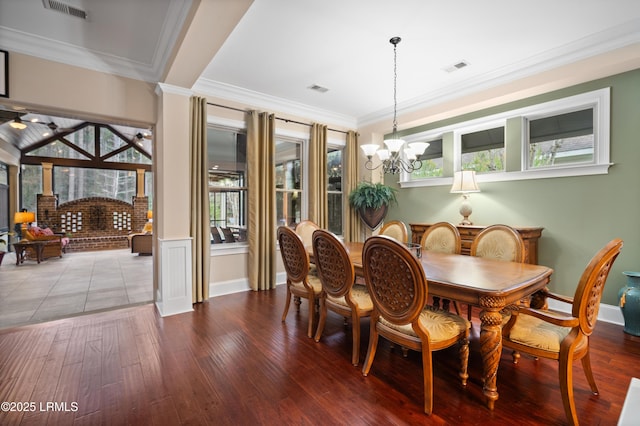 33 Little Pine Ct, Bluffton, SC 29910 - dining space featuring ornamental molding, a wealth of natural light, a notable chandelier, and visible vents