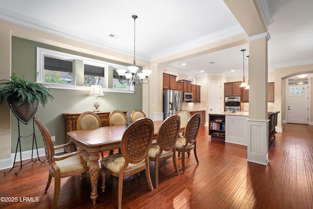 33 Little Pine Ct, Bluffton, SC 29910 - dining space with arched walkways, baseboards, visible vents, an inviting chandelier, and ornate columns