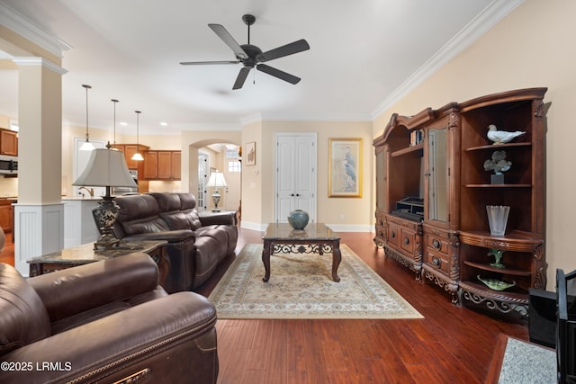 33 Little Pine Ct, Bluffton, SC 29910 - living room featuring crown molding, ceiling fan, arched walkways, baseboards, and dark wood-style floors