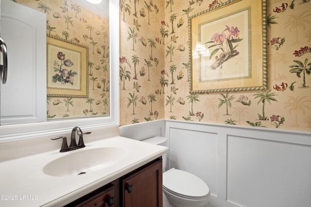 33 Little Pine Ct, Bluffton, SC 29910 - half bathroom featuring a wainscoted wall, toilet, wallpapered walls, a decorative wall, and vanity