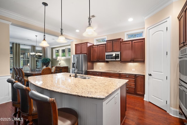 33 Little Pine Ct, Bluffton, SC 29910 - kitchen featuring a kitchen bar, appliances with stainless steel finishes, a sink, and a kitchen island with sink