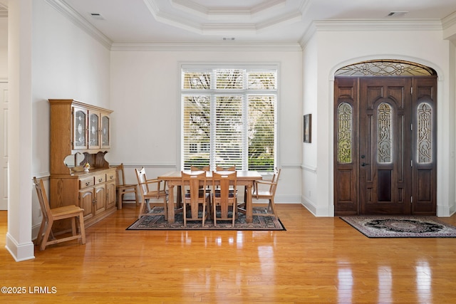 67 Winding Oak Dr, Okatie, SC 29909 - dining area with light wood-style flooring, crown molding, and a raised ceiling