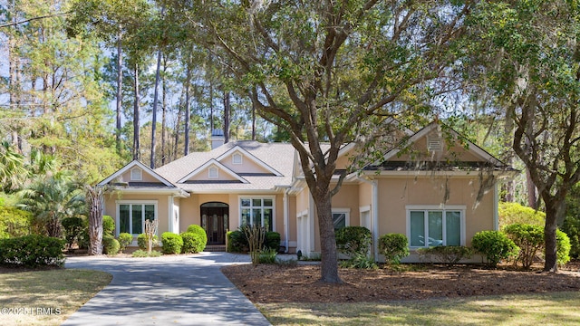 67 Winding Oak Dr, Okatie, SC 29909 - view of front facade with stucco siding and driveway