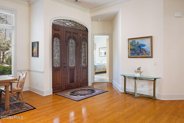 67 Winding Oak Dr, Okatie, SC 29909 - entrance foyer featuring wood finished floors, crown molding, and baseboards