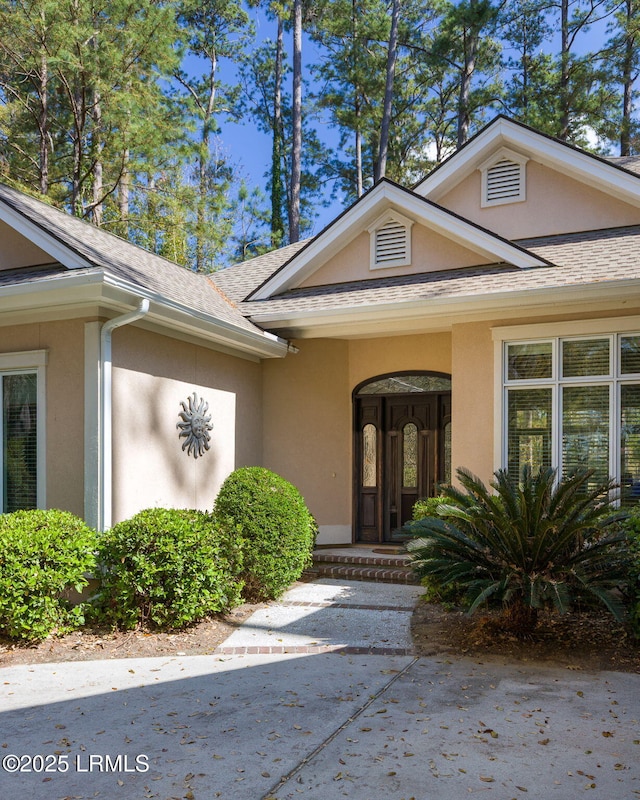 67 Winding Oak Dr, Okatie, SC 29909 - entrance to property featuring stucco siding and roof with shingles
