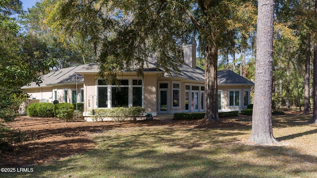 67 Winding Oak Dr, Okatie, SC 29909 - rear view of property with a yard and a chimney