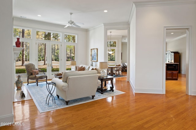 67 Winding Oak Dr, Okatie, SC 29909 - living room with crown molding, ceiling fan, light wood-style floors, baseboards, and french doors