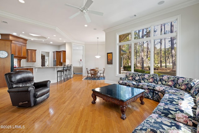 67 Winding Oak Dr, Okatie, SC 29909 - living area with light wood finished floors, ceiling fan, crown molding, baseboards, and recessed lighting