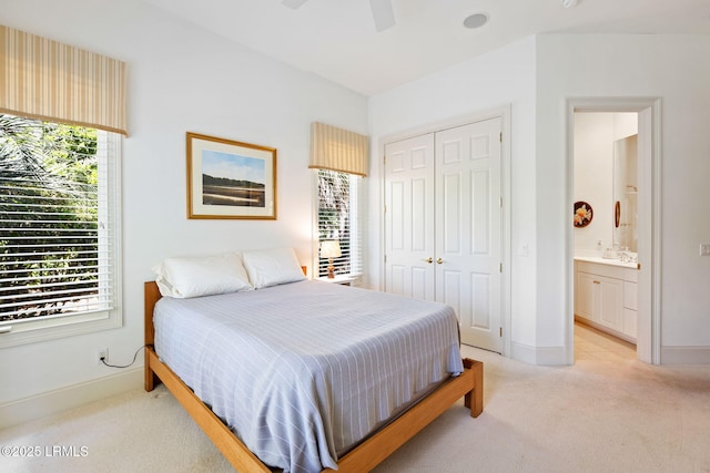 67 Winding Oak Dr, Okatie, SC 29909 - bedroom featuring light carpet, multiple windows, a closet, and baseboards
