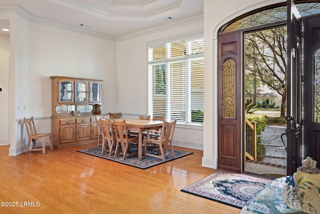 67 Winding Oak Dr, Okatie, SC 29909 - dining room featuring light wood-type flooring, ornamental molding, and a wainscoted wall