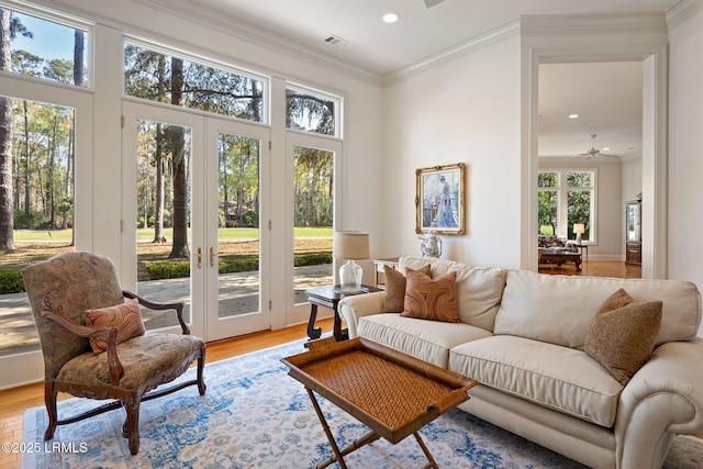 67 Winding Oak Dr, Okatie, SC 29909 - living room featuring light wood-type flooring, a ceiling fan, recessed lighting, french doors, and crown molding