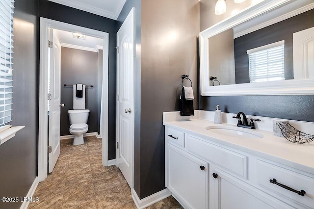 120 Wall St, Savannah, GA 31405 - bathroom with crown molding, toilet, vanity, and baseboards