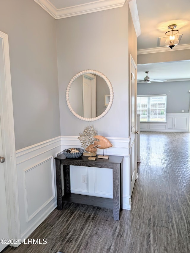 120 Wall St, Savannah, GA 31405 - hallway with a decorative wall, ornamental molding, wood finished floors, and wainscoting