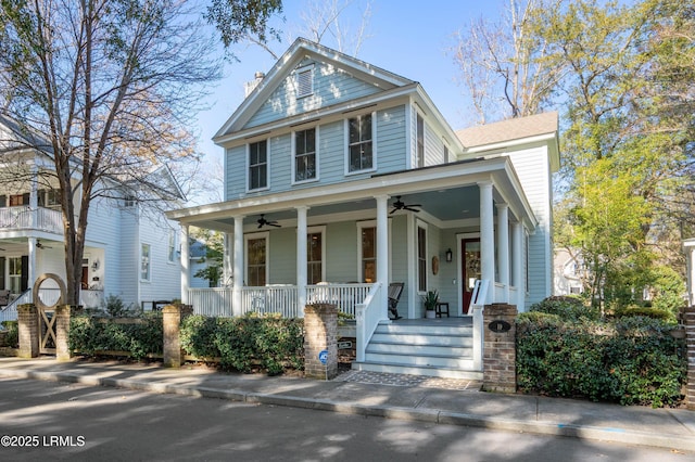 view of front facade with ceiling fan and a porch