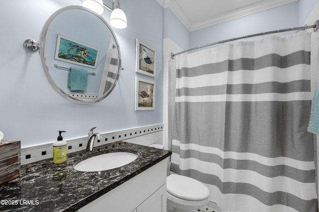 bathroom featuring vanity, crown molding, and toilet