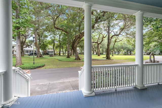 wooden deck with a yard