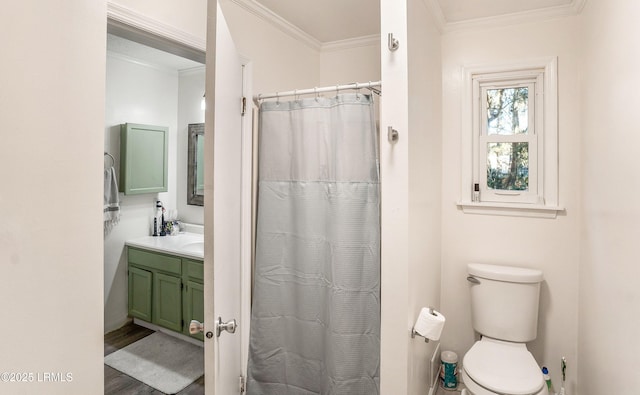 bathroom with walk in shower, toilet, wood-type flooring, ornamental molding, and vanity