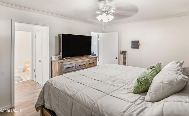 bedroom featuring connected bathroom, crown molding, light hardwood / wood-style flooring, and ceiling fan