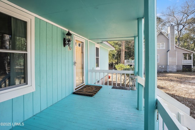 wooden terrace with a porch