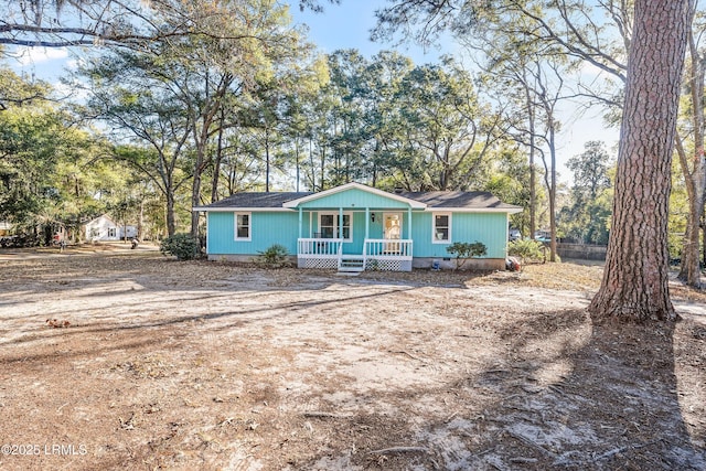 ranch-style home featuring covered porch