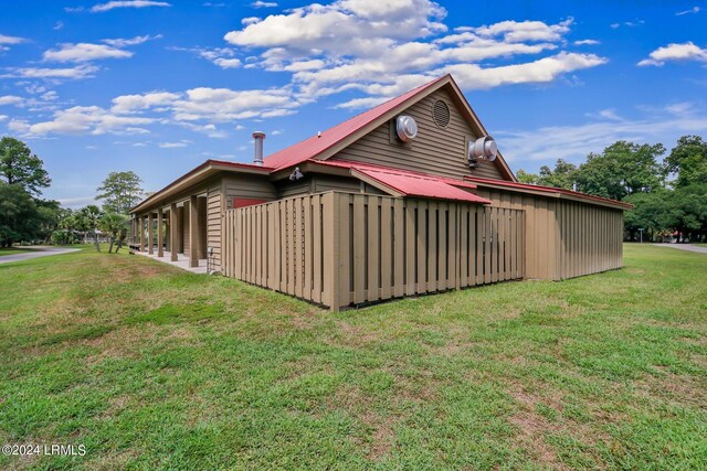view of property exterior with a yard