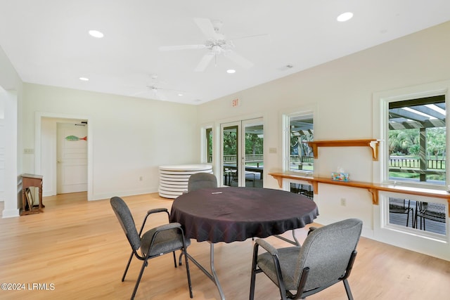 dining space featuring ceiling fan, light hardwood / wood-style flooring, and a wealth of natural light