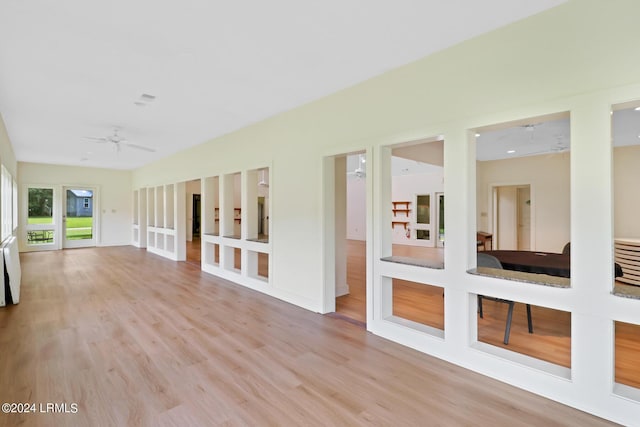 interior space featuring radiator heating unit and ceiling fan