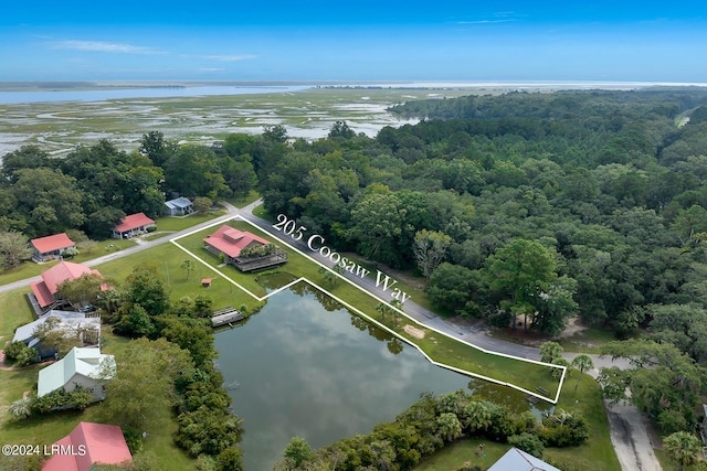 birds eye view of property featuring a water view