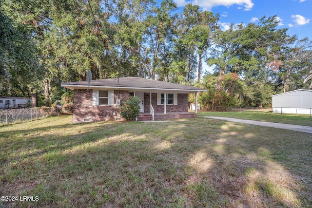 ranch-style house with a front yard