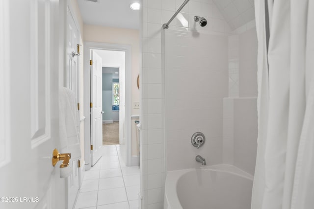 full bathroom featuring tile patterned floors and shower / bath combo with shower curtain